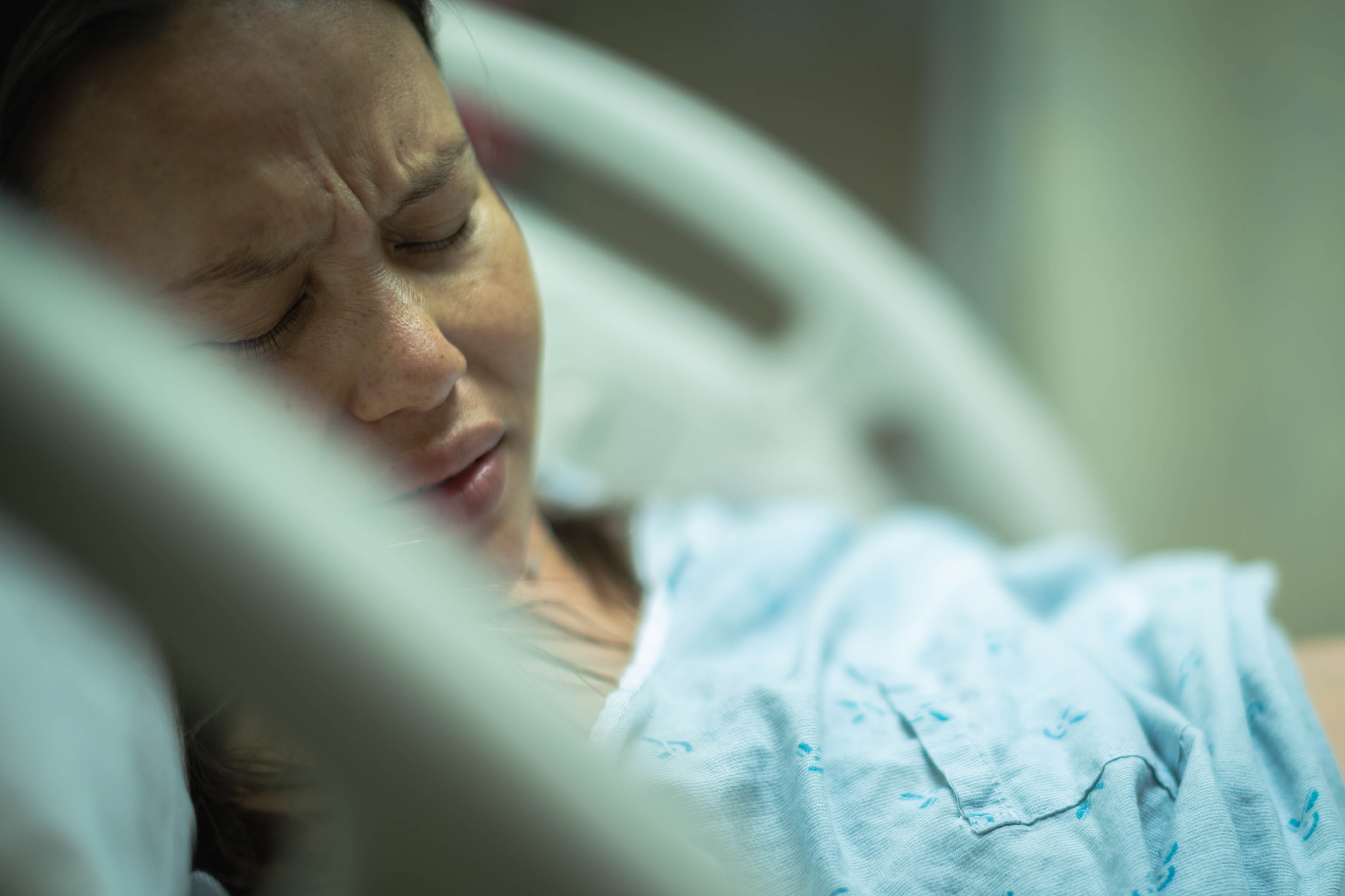 A,Sick,Woman,Patient,Lying,In,A,Hospital,Bed,Depressed